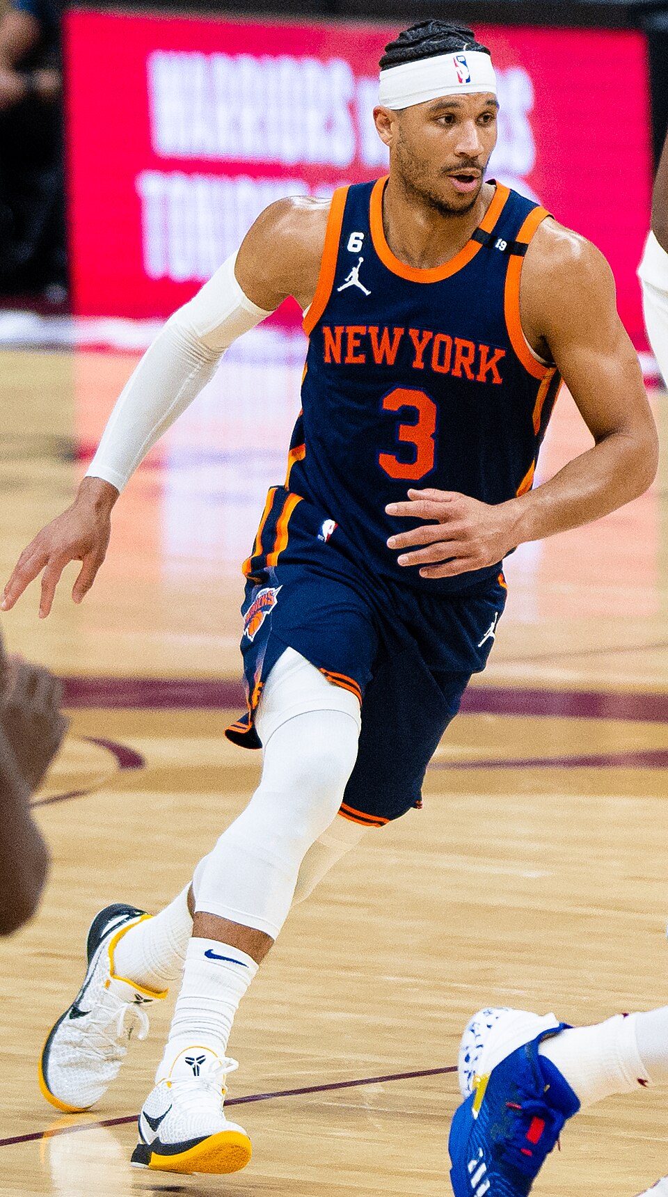 New York Knicks guard Josh Hart in a white Knicks uniform during a 2023 playoff game in Cleveland